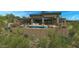 Beautiful backyard featuring a pool, spa, outdoor seating, and desert landscaping at 39878 N 105Th Way, Scottsdale, AZ 85262