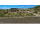 Beautiful desert home exterior featuring a paver driveway and attached garage at 39878 N 105Th Way, Scottsdale, AZ 85262