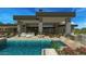 Backyard featuring a swimming pool, spa, outdoor kitchen area, patio furniture and desert landscaping at 39878 N 105Th Way, Scottsdale, AZ 85262