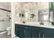 Modern bathroom featuring a double vanity with matte black fixtures and a frameless glass enclosed shower at 40807 N Barnum Way, Anthem, AZ 85086