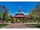 Charming gazebo with benches and a clock tower, set among mature trees and landscaped grounds, offering a community gathering spot at 40807 N Barnum Way, Anthem, AZ 85086