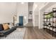 Inviting living room with a bright entryway, a comfortable couch and access to the stairway at 40807 N Barnum Way, Anthem, AZ 85086