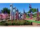 Scenic memorial with American flags in a beautifully landscaped setting, under a clear blue sky at 40807 N Barnum Way, Anthem, AZ 85086