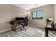 This office features a large window, neutral tones, and two work stations at 40807 N Barnum Way, Anthem, AZ 85086