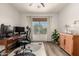 Bright office features a desk, natural light, decor, and luxury vinyl plank flooring at 40807 N Barnum Way, Anthem, AZ 85086