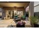 Relaxing patio with comfortable seating, complemented by colorful flowers and stylish decor at 40807 N Barnum Way, Anthem, AZ 85086