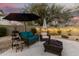 Backyard patio with a fire pit, comfortable seating, and string lights for evening enjoyment at 40807 N Barnum Way, Anthem, AZ 85086
