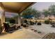 Inviting covered patio with wicker furniture and outdoor seating area, perfect for relaxation at 40807 N Barnum Way, Anthem, AZ 85086
