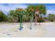 Interactive splash pad with whimsical water features provides a fun and safe environment for children to play and cool off at 40807 N Barnum Way, Anthem, AZ 85086
