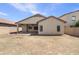 Private backyard with covered patio, perfect for outdoor relaxation and entertainment at 41344 W Laramie Rd, Maricopa, AZ 85138