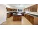 Large kitchen with an island, stainless steel appliances, and beautiful cabinetry at 41344 W Laramie Rd, Maricopa, AZ 85138