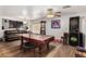 Spacious game room with pool table, dart board, and media at 4321 E Morenci Rd, San Tan Valley, AZ 85143