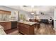 Open kitchen with modern appliances, granite countertops, and adjacent dining area at 4321 E Morenci Rd, San Tan Valley, AZ 85143