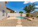 This beautiful backyard features low maintenance landscaping, a charming pool and ample patio space for relaxing at 453 E Baylor Ln, Gilbert, AZ 85296