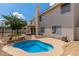 The backyard offers a pool, patio, and lush landscaping ideal for outdoor living and entertaining at 453 E Baylor Ln, Gilbert, AZ 85296
