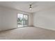 An inviting bedroom features a sliding glass door to a private balcony at 453 E Baylor Ln, Gilbert, AZ 85296