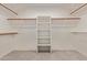 A large walk-in closet features ample shelving and hanging space for organization at 453 E Baylor Ln, Gilbert, AZ 85296
