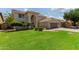 Charming home featuring a manicured lawn, desert landscaping, and an attached two-car garage at 453 E Baylor Ln, Gilbert, AZ 85296