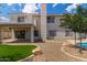The exterior boasts a balcony, covered patio, and a well-manicured yard for outdoor living and entertaining at 453 E Baylor Ln, Gilbert, AZ 85296