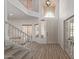 Inviting foyer with high ceilings and grand staircase with lots of light at 453 E Baylor Ln, Gilbert, AZ 85296