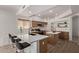 Bright and modern kitchen with a breakfast bar, center island, and stainless steel appliances at 453 E Baylor Ln, Gilbert, AZ 85296