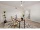 Well-lit home office features fan, desk, and easy access to outside areas at 453 E Baylor Ln, Gilbert, AZ 85296