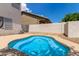 Sparkling pool with mature trees and lush lawn; perfect for fun and relaxing in the sunshine at 453 E Baylor Ln, Gilbert, AZ 85296