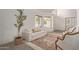 Comfortable sitting room features contemporary sofa and lots of natural light at 453 E Baylor Ln, Gilbert, AZ 85296