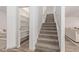 A carpeted staircase leads to the upper level, with a large shelved closet nearby at 453 E Baylor Ln, Gilbert, AZ 85296
