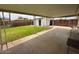 Covered patio with a large, grassy backyard and privacy fence, great for entertaining at 4602 N 50Th Ave, Phoenix, AZ 85031