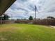 Large backyard features lush green grass and tall, wooden fence for privacy at 4602 N 50Th Ave, Phoenix, AZ 85031
