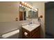 Cozy bathroom featuring a vanity with sink and a mirror with overhead lighting at 4602 N 50Th Ave, Phoenix, AZ 85031