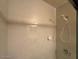 Bright bathroom featuring marble tiling and modern shower head at 4602 N 50Th Ave, Phoenix, AZ 85031