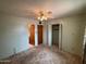 Bright bedroom including a ceiling fan, window, and built-in storage at 4602 N 50Th Ave, Phoenix, AZ 85031
