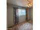 Bedroom showcasing a window allowing natural light and curtain accents at 4602 N 50Th Ave, Phoenix, AZ 85031