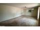 Spacious living room featuring neutral tones, carpeted floor and ceiling fan at 4602 N 50Th Ave, Phoenix, AZ 85031