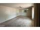 View of the living room with a large mirror, fan, and curtained window at 4602 N 50Th Ave, Phoenix, AZ 85031