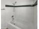 Clean bathroom featuring a tiled shower and tub combination with stylish fixtures at 4607 W Becker Ln, Glendale, AZ 85304