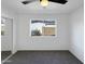 Cozy bedroom with a ceiling fan, carpeted floors, and natural light from the window at 4607 W Becker Ln, Glendale, AZ 85304