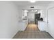 Clean, bright kitchen with stainless steel appliances, white cabinets, and light tile floor at 4607 W Becker Ln, Glendale, AZ 85304