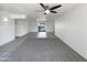 Spacious, airy living area featuring neutral carpets and tile leading to a patio entrance at 4607 W Becker Ln, Glendale, AZ 85304