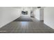 Spacious living room showcasing tile and carpeted flooring, with a ceiling fan at 4607 W Becker Ln, Glendale, AZ 85304