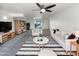 Bright living room with neutral decor, tile accents, and sliding doors to the outdoor pool at 4607 W Becker Ln, Glendale, AZ 85304