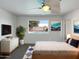 Cozy bedroom with a view of the pool, soft carpet, and a contemporary ceiling fan at 4607 W Becker Ln, Glendale, AZ 85304