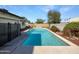 Backyard pool with blue skies and secure black fencing at 4607 W Becker Ln, Glendale, AZ 85304
