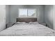 Bedroom with vaulted ceiling, window and gray walls, carpet, large bed, and two side tables at 520 N Stapley Dr # 256, Mesa, AZ 85203