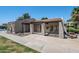 Exterior of a community clubhouse with sidewalks and minimal landscaping at 520 N Stapley Dr # 256, Mesa, AZ 85203