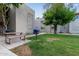 Community common area with BBQ grill and seating under shade trees at 520 N Stapley Dr # 256, Mesa, AZ 85203