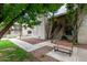 Apartment complex exterior featuring stairs to units and a bench under shade trees at 520 N Stapley Dr # 256, Mesa, AZ 85203