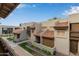Exterior view of townhomes, showcasing a well-maintained courtyard at 520 N Stapley Dr # 256, Mesa, AZ 85203